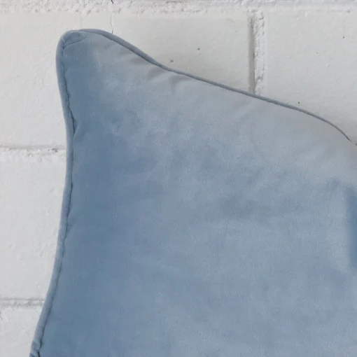 Focused view of Rectangle cushion cover. The shot shows details of its velvet material and light blue colour.