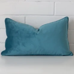 Lovely light teal cushion made from velvet fabric and in an elegant rectangle size.