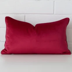 Striking rectangle magenta cushion cover featuring a quality velvet fabric.