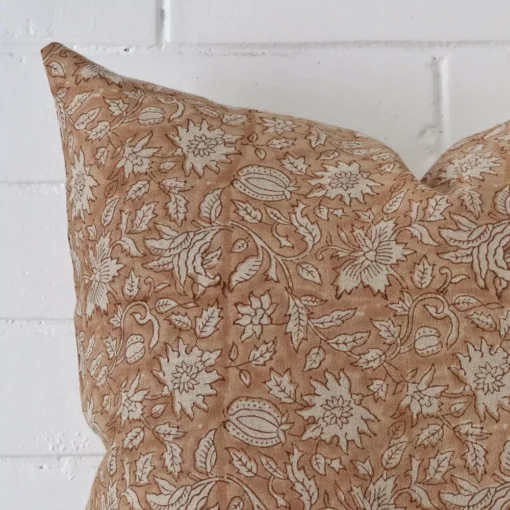 Close up image of designer square cushion. The image allows you to see the floral style more thoroughly.