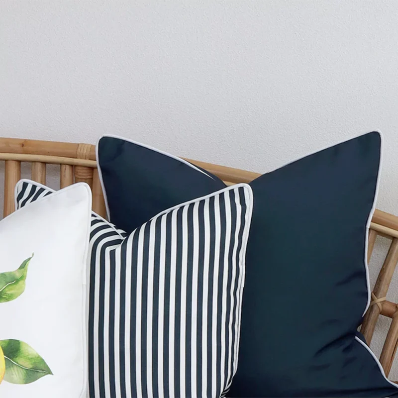 Close-range image of 3 mediterranean cushions. The colour and material can be seen in detail.