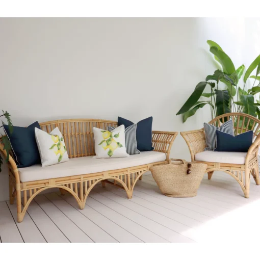 A lovely combination of 7 outdoor navy lounge cushions in a cozy lounge.