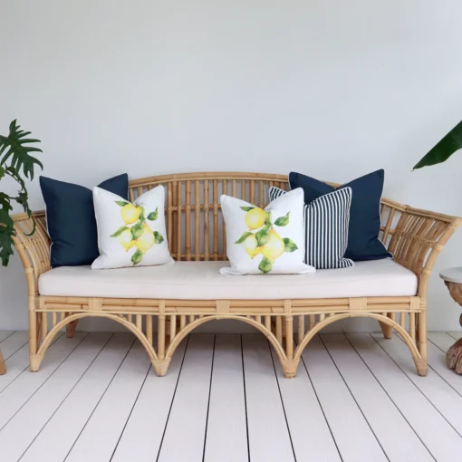 A set of 5 mediterranean navy outdoor sofa cushions in a lounge creating a chic and tranquil ambiance.