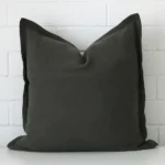 A premium linen moss green cushion in a square size.