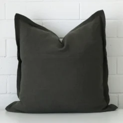 A premium linen moss green cushion in a square size.