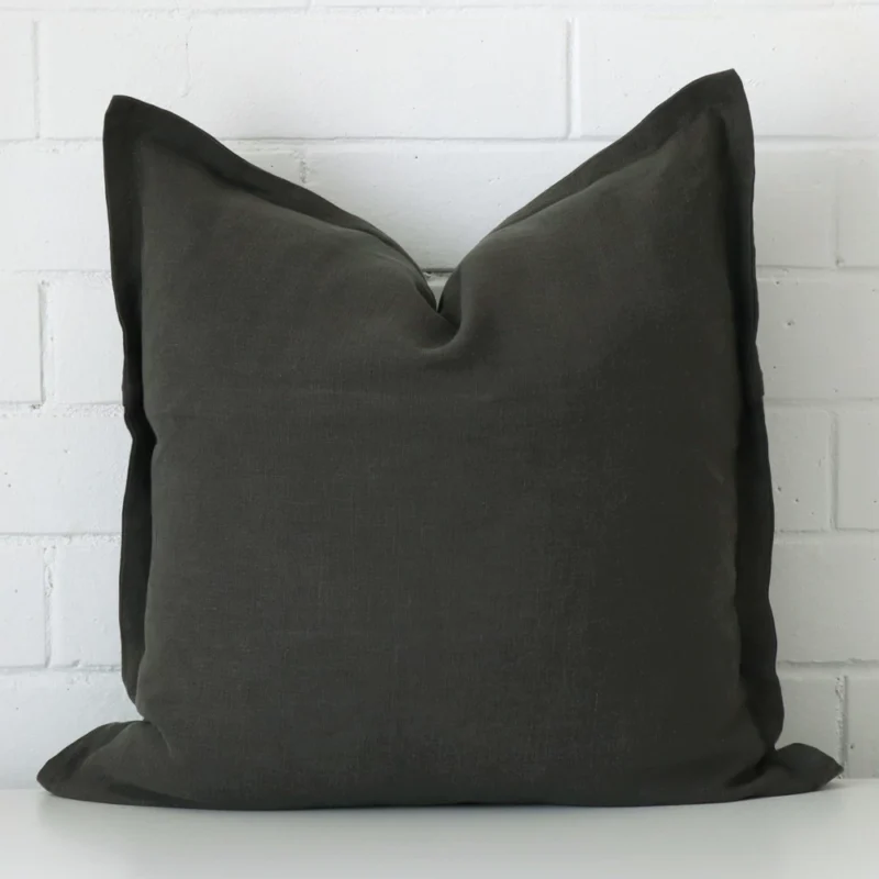 A premium linen moss green cushion in a square size.
