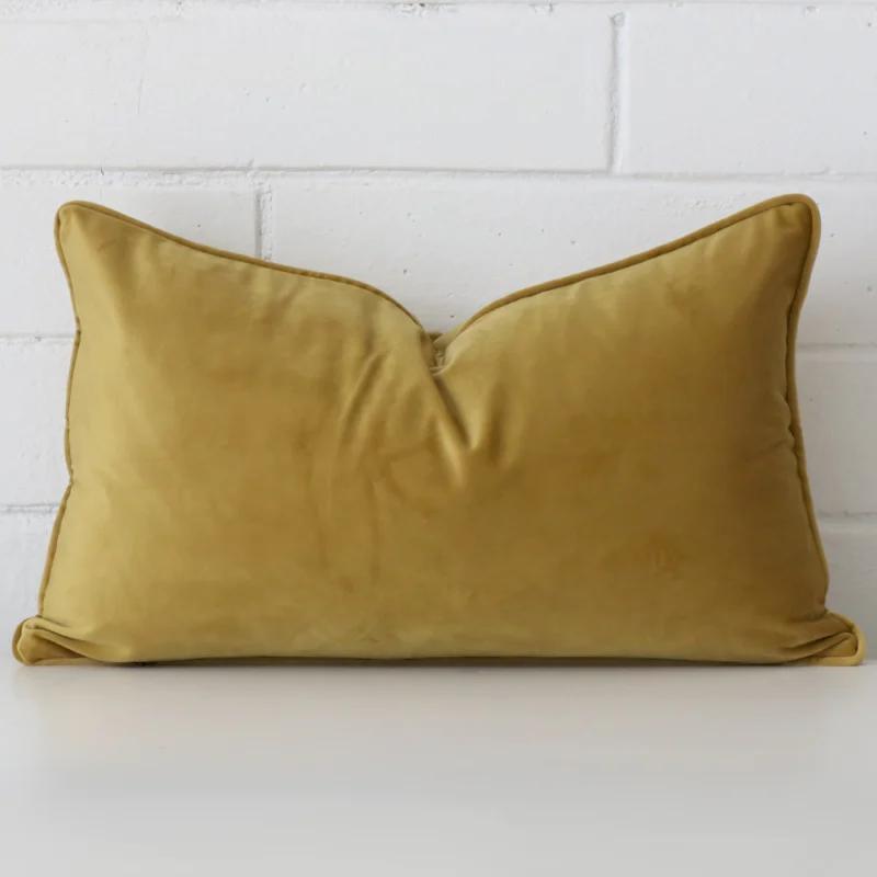 Vibrant velvet cushion cover in a stylish square size with mustard colouring.
