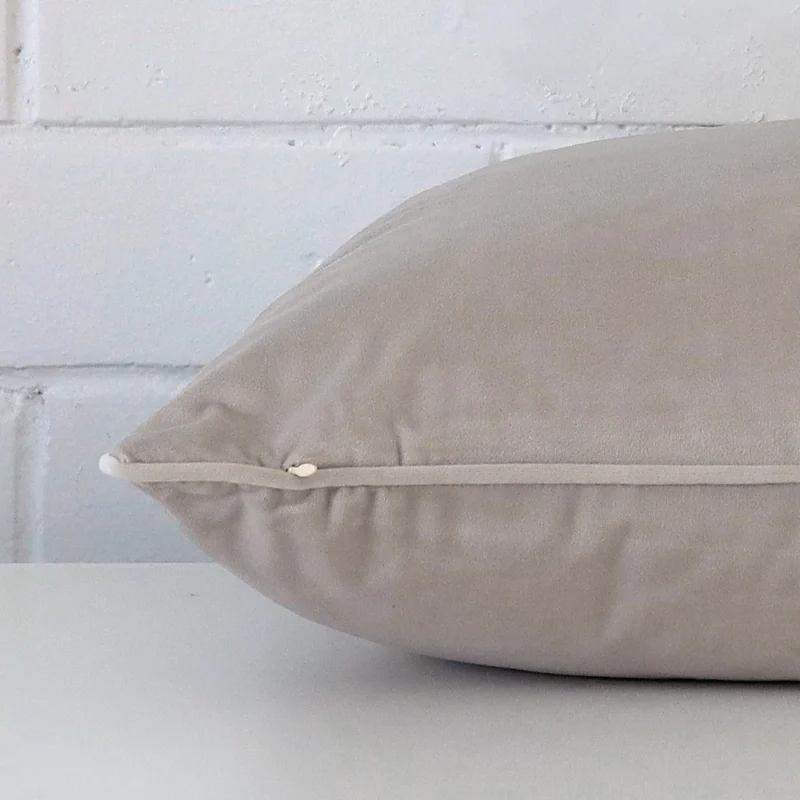 Side edge of large cushion. The velvet material and natural colour can be seen from this lateral viewpoint.