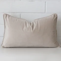 A premium velvet natural cushion in a rectangle size.