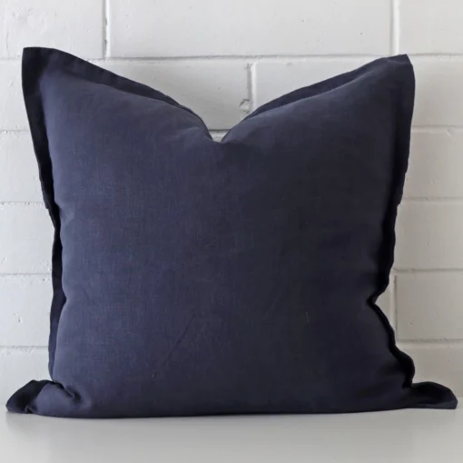 Vibrant linen cushion cover in a stylish square size with navy colouring.