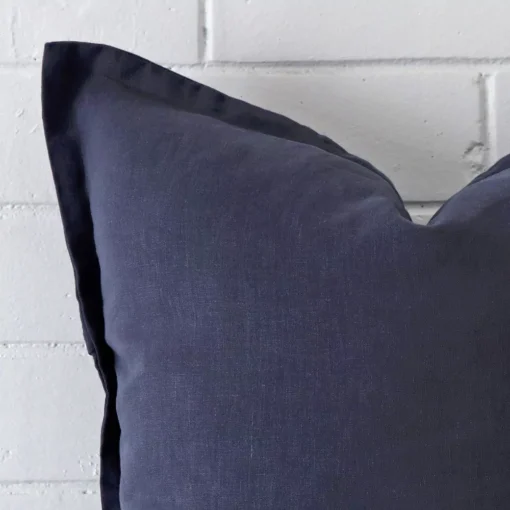 Zoomed in visual of linen square cushion cover in navy.