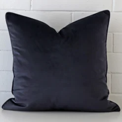 Striking large navy cushion cover featuring velvet fabric.