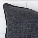 A detailed shot of this charcoal cushion cover that has linen fabric and a rectangle size.