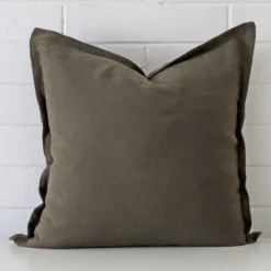 A premium linen olive cushion boasting a design and in a square size.