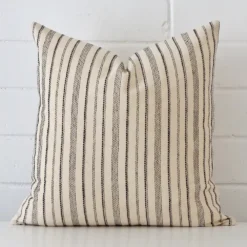 A gorgeous designer square cushion It has an eye-catching striped design.