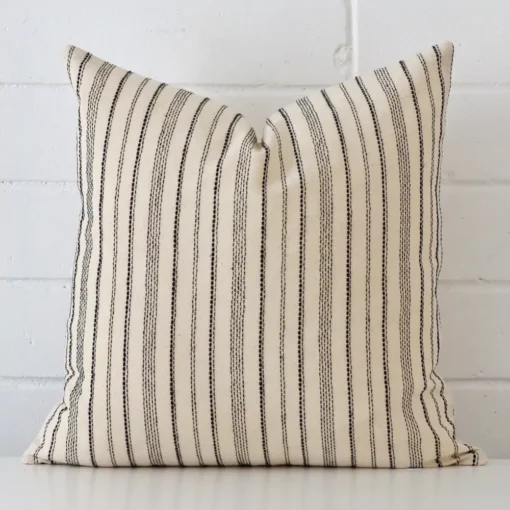 A gorgeous designer square cushion It has an eye-catching striped design.