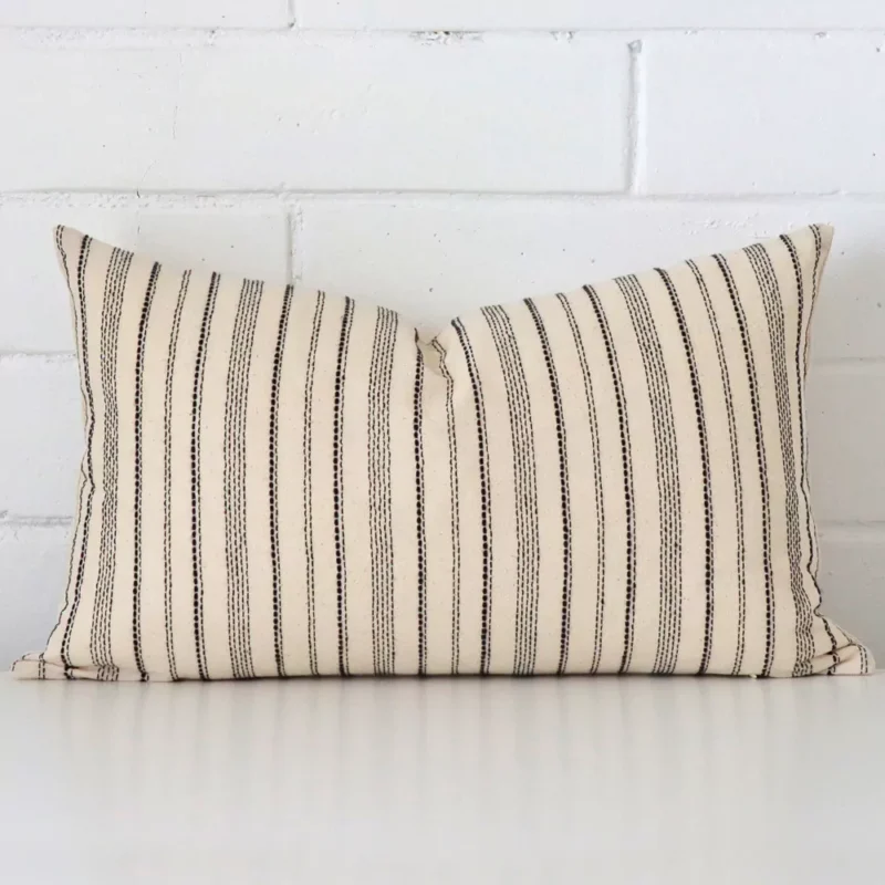 otis-striped-designer-cushion-cover-rectangle-art104-30 Rectangle striped cushion cover sitting upright in front of a brick wall. It has been made from a quality designer material.