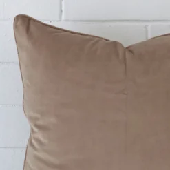 A detailed shot of this oyster cushion cover that has velvet fabric and a square size.