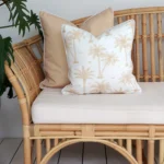 Envision outdoor seating adorned with two beige couch cushions infusing a tropical vibe into your outdoor oasis.