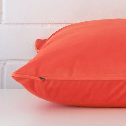 Side image of peach cushion cover