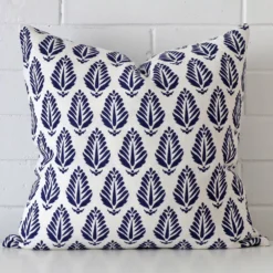 Gorgeous square linen cushion cover that has a blue hue. It has a graceful geometric design.