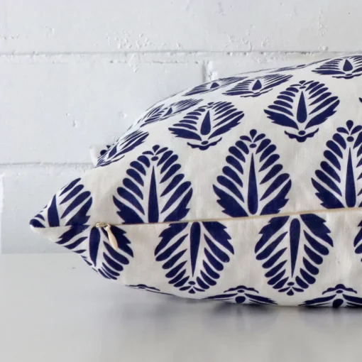 Lateral view of front and back panels of this geometric linen cushion cover in a square size and with blue colouring.