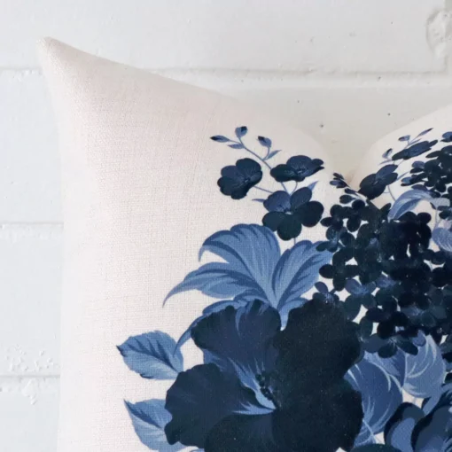 Focused view of floral square cushion cover. The shot shows details of its linen material.