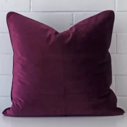 Front view of large cushion. Crafted from a special velvet material in a purple colour.