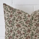 Focused view of floral square cushion cover. The shot shows details of its designer material.