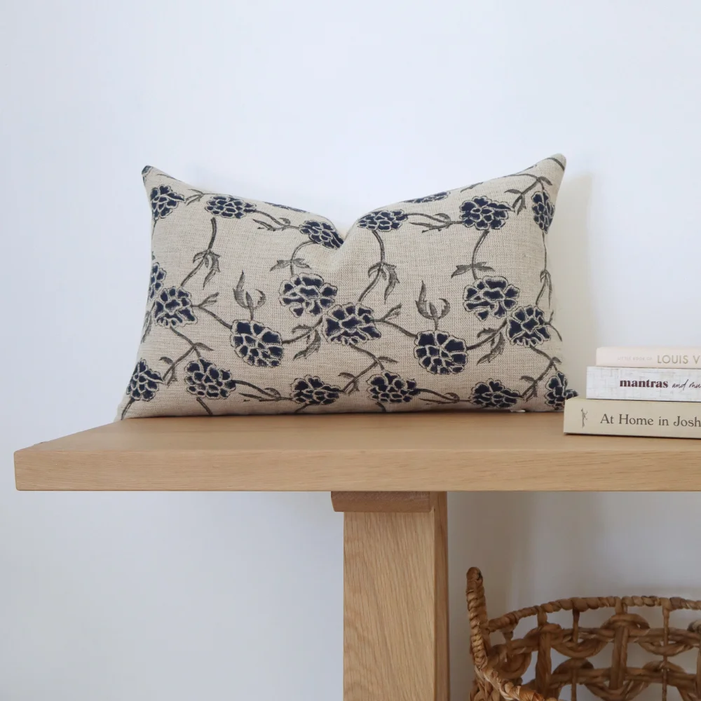 A rectangle cushion is placed on a modern bench seat.