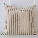 A premium designer cushion boasting a striped design and in a square size.