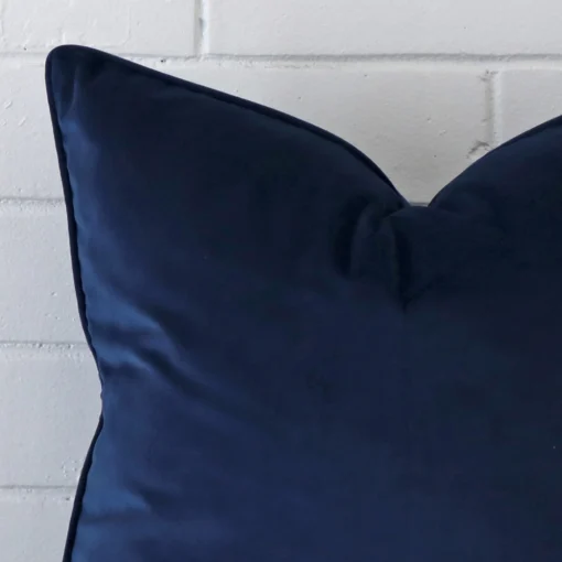 Cropped shot of top left corner of this Royal blue cushion cover. This viewpoint shows the velvet fabric and large shape with more precision.