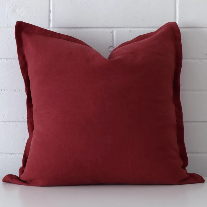 rust-linen-cushion-cover-large-sc819-55 Front view of square cushion. Crafted from a special linen material in a rust colour.