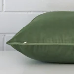 Lateral viewpoint of this velvet large cushion. The design and sage colour is shown from the side showing the front and rear panels.