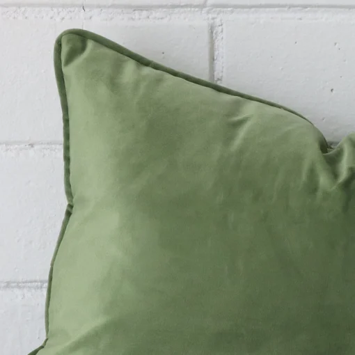 Close up image of velvet rectangle cushion. The image allows you to see the sage hue more thoroughly.