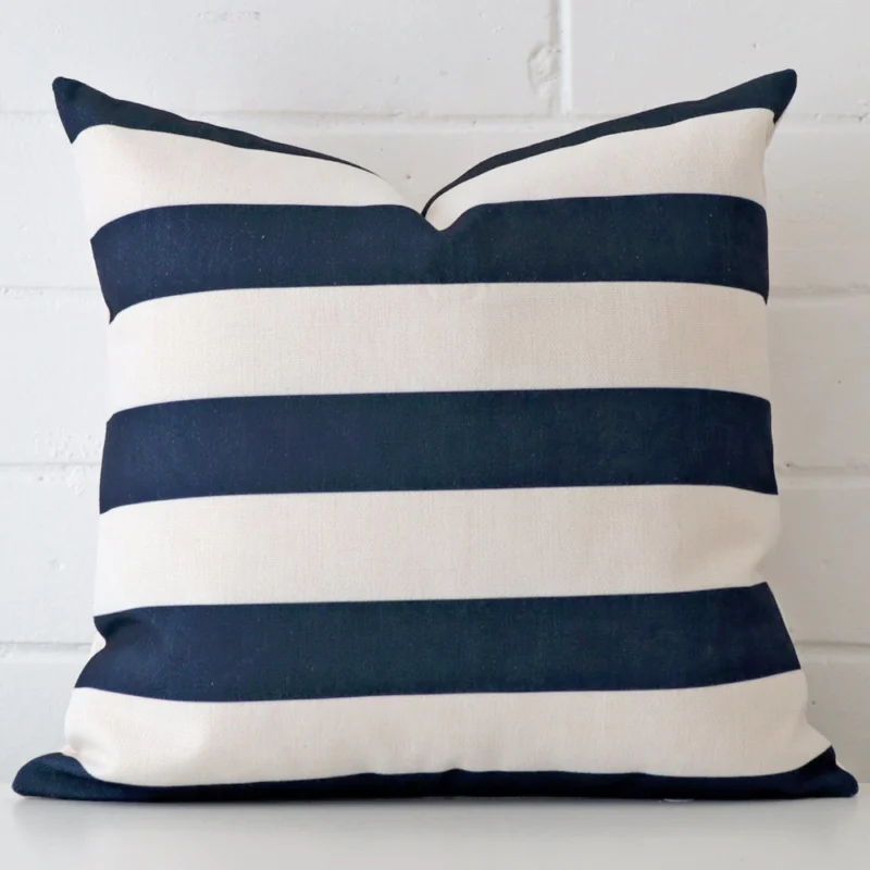 stripe-hamptons-cushion-cover-45cm-x-45cm-sc623-45 Linen cushion cover features prominently against a white wall. It is a square design and has a striped decorative finish.