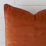 Precision shot of this large terracotta cushion cover. It is possible to see the velvet fabric in greater depth.