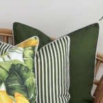 The details are magnified in this close-up view of three tropical olive couch cushions.