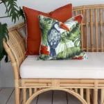 Cozy terracotta outdoor couch cushions nestled amidst the lush greenery of the outdoors.