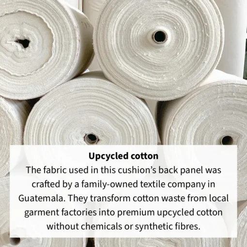 Large rolls of upcycled cotton fabric stacked on top of each other.