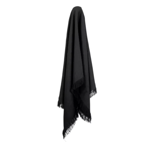 A linen throw hanging on a hook that has an elegant black colour.
