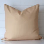 A premium outdoor beige cushion in a large size.