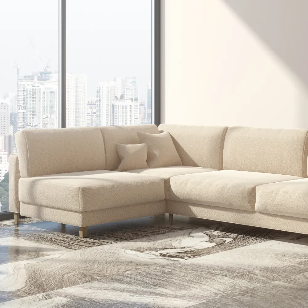 A beige sofa is shown against a wall and window showing a city scape in the background.