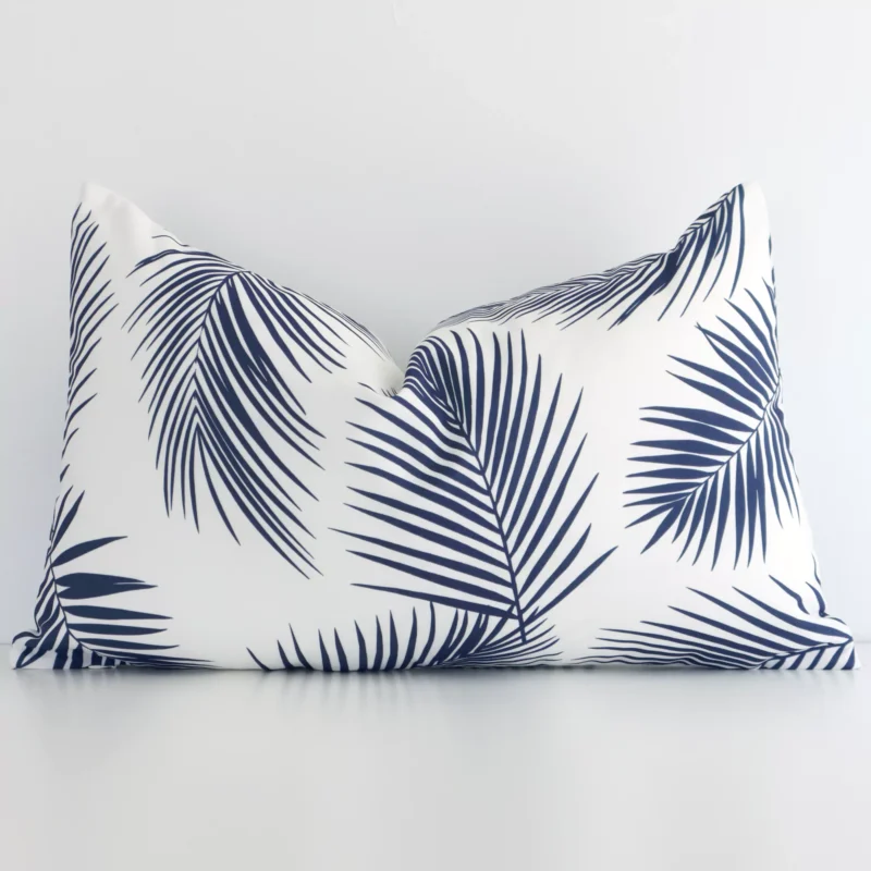 byron-palm-waterproof-rectangular-navy-outdoor-cushion-cover-‚äì-rectangle---sc712-30 Navy outdoor cushion cover features prominently against a white wall. It is a rectangle design and has a palm decorative finish.