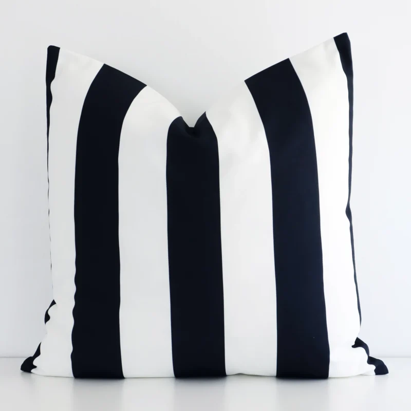 byron-striped-waterproof-black-and-white-large-outdoor-cushion-cover-‚äì-large---sc697-55 A lovely large black and white cushion cover arranged in front of a white wall. The striped style complements the outdoor material.