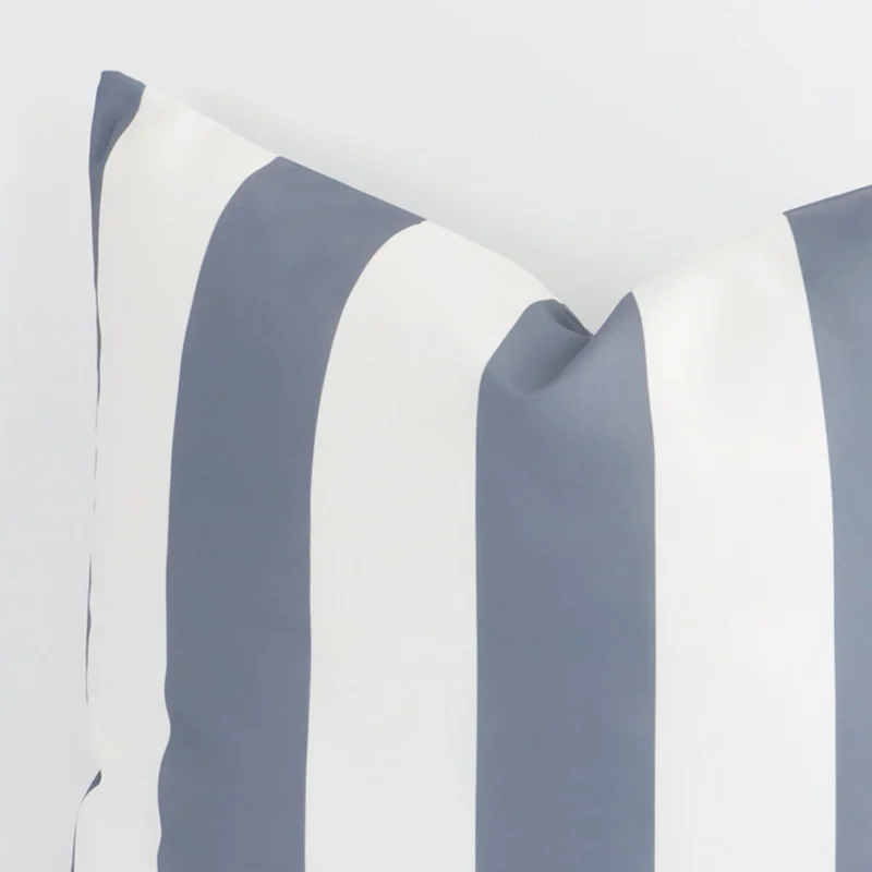 A close up image of this striped large cushion. The image shows details of its outdoor fabric and grey colour.