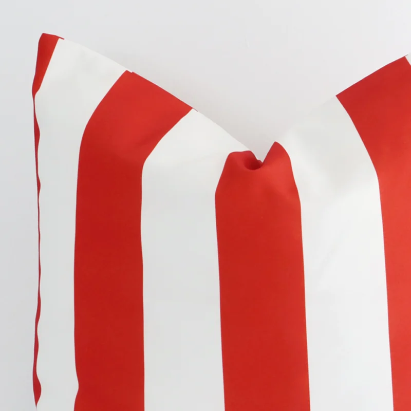 Zoomed in visual of outdoor large cushion cover in white and red. The intricacies of its striped design are visible.