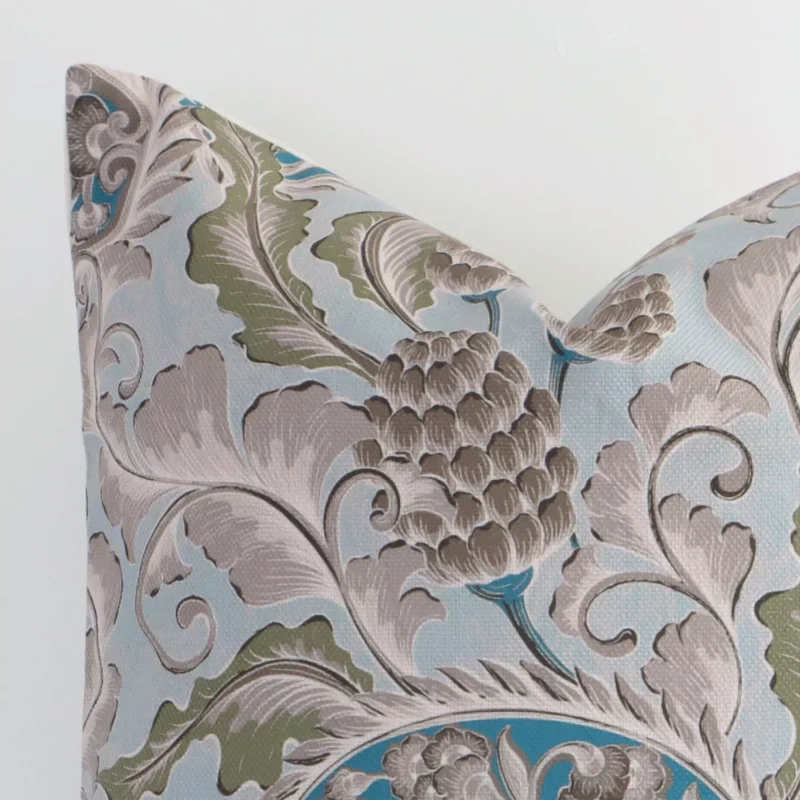 Macro image of a linen square cushion cover. The shot shows the colourful hue and patterned style more thoroughly.