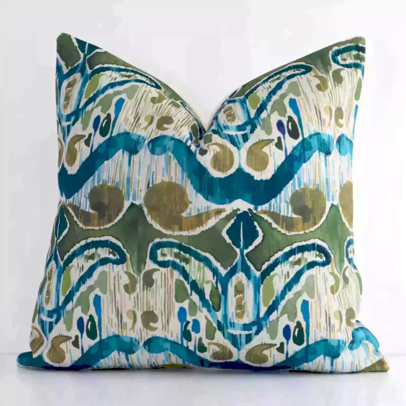 bold-ikat-cushion-cover---45cm-x-45cm---sc626-45 Colourful square cushion leans elegantly against a white wall. It has been crafted from a high quality linen material and has a square shape.