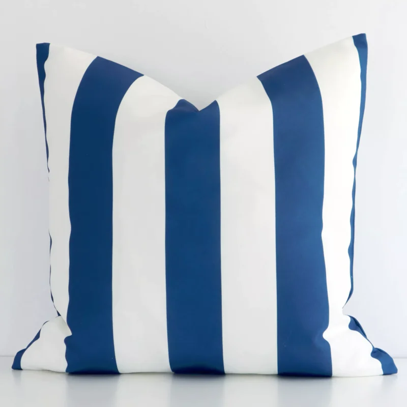 byron-striped-waterproof-navy-large-outdoor-cushion-cover-large-sc951-55 A hero shot of a striped large cushion cover. It is made from a deluxe outdoor fabric and features a navy colour.